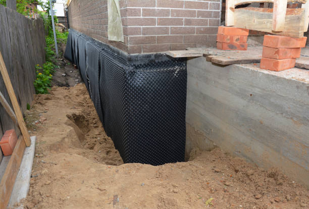 Happy homeowners after waterproofing job in Clarksburg